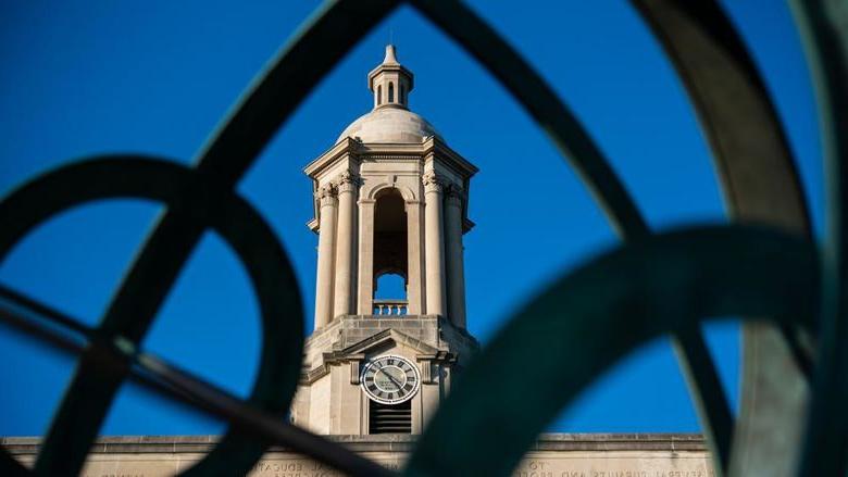 Old Main bell tower seen through armillary sphere sculpture