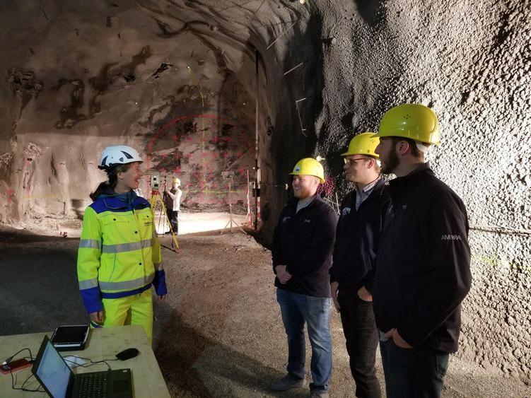 Students and Joe Scott speak with engineer before working on 360-degree video in Europe